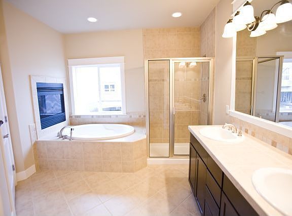 Master bath with 2nd gas fireplace and gorgeous ceramic tile