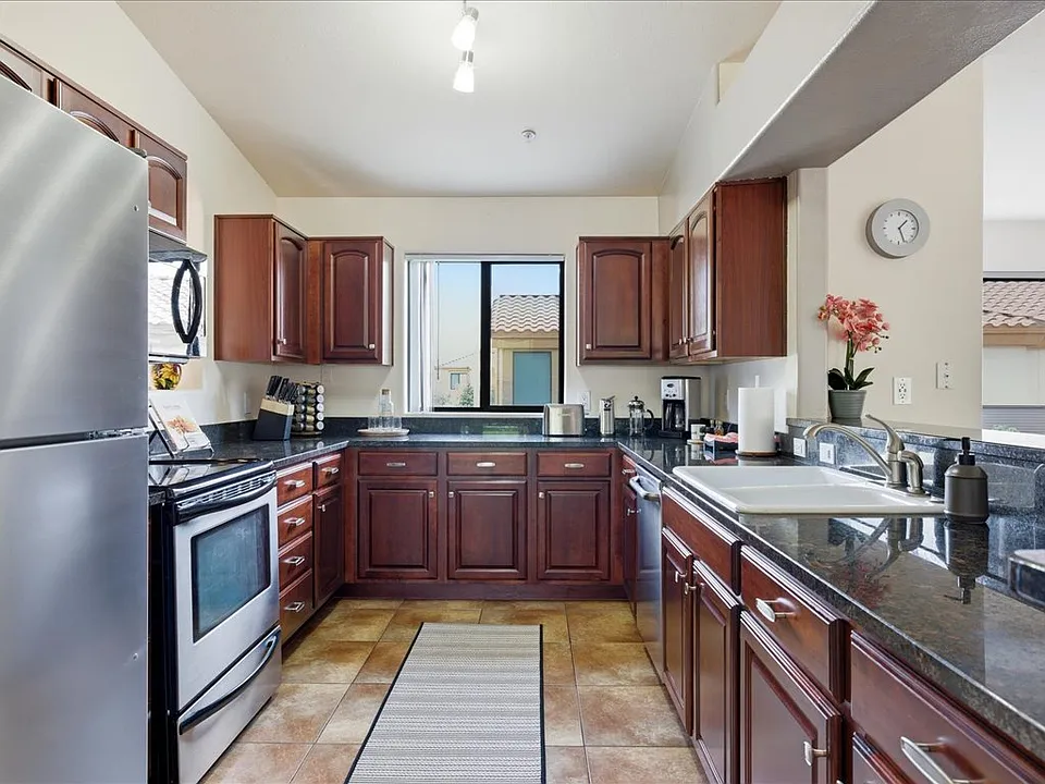 The fully equipped kitchen features quality appliances and all essentials for effortless meal preparation.