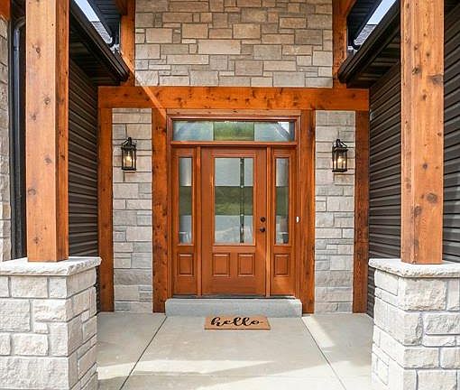Upgraded Front door with etched glass. Transom and side lites are standard.