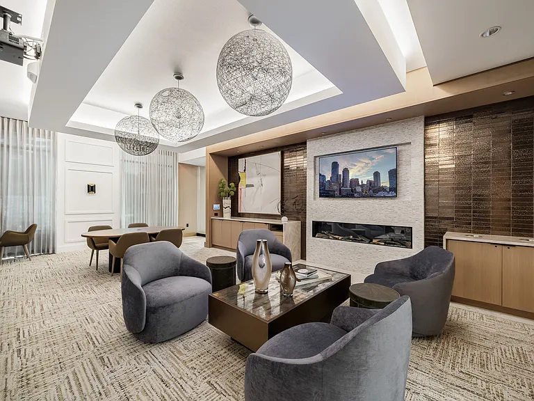 Media lounge offering both lounge and theater seating and multiple TVs