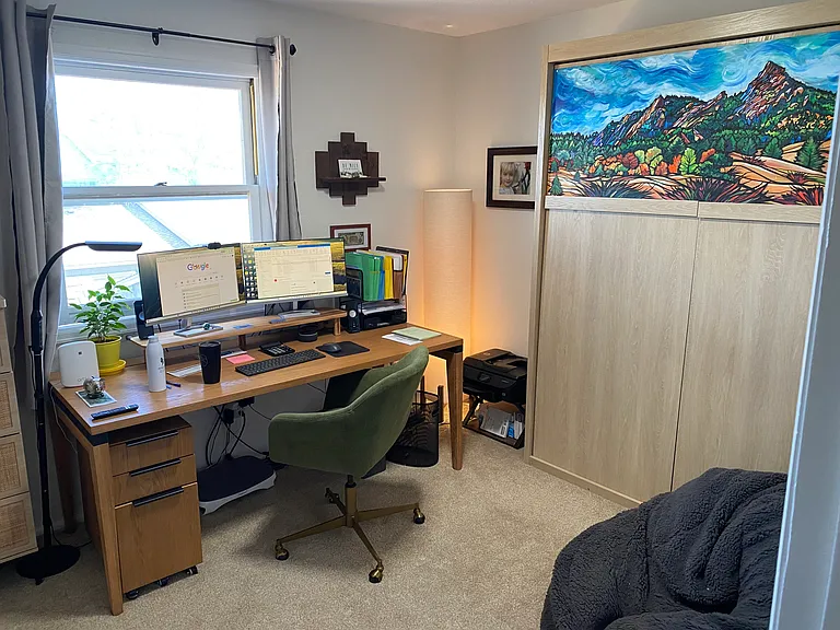 3rd bedroom with office desk with pull down Murphy bed. TV's are mounted in each bedroom.