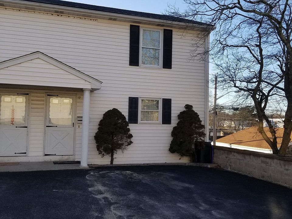 Front with 2 parking spaces and 1 more not shown