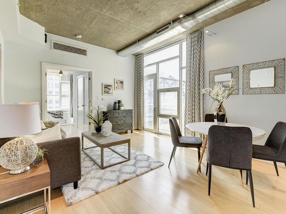 View from master bedroom into open concept living room and kitchen