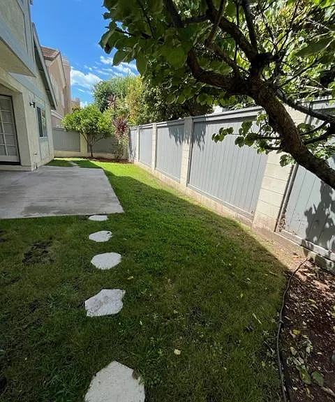 Private fenced yard with patio