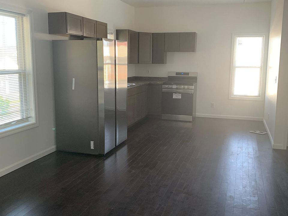 Kitchen with hardwood floors and stainless steel appliances!