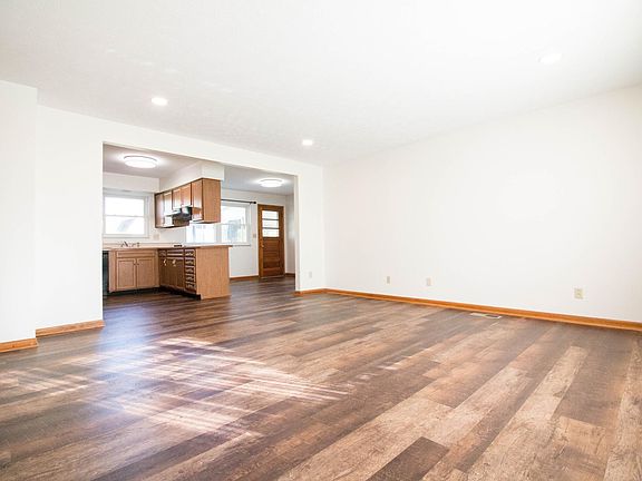 Living room with view of kitchen and dining