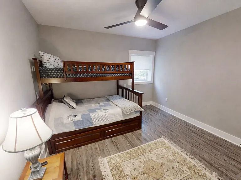 First level bedroom 1 bunkbed with queen and twin bed