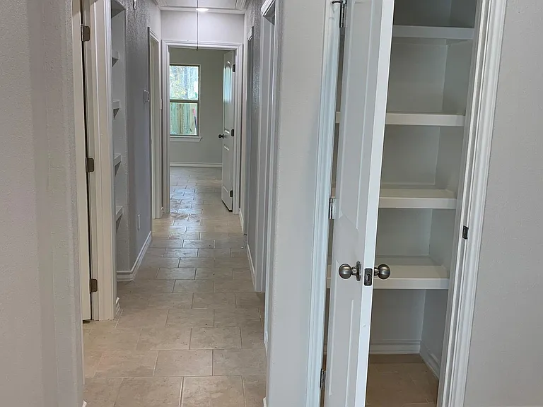 pantry and hall way to rooms, from kitchen