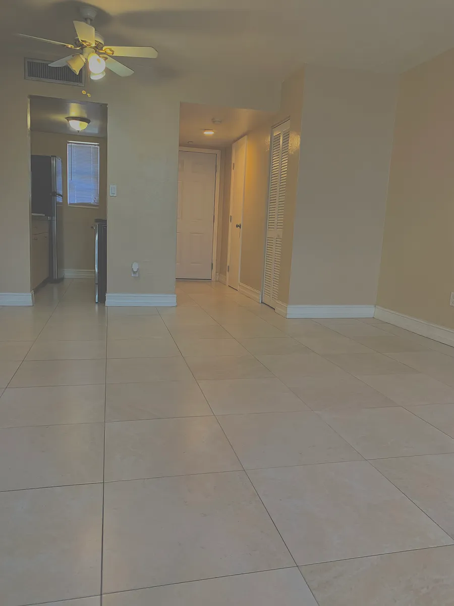 Spacious Open-Concept Loft-Style Greatroom that combines an inviting Living and Dining area, exuding elegance and comfort while maximizing natural light. - 10901 SW 88th St #207