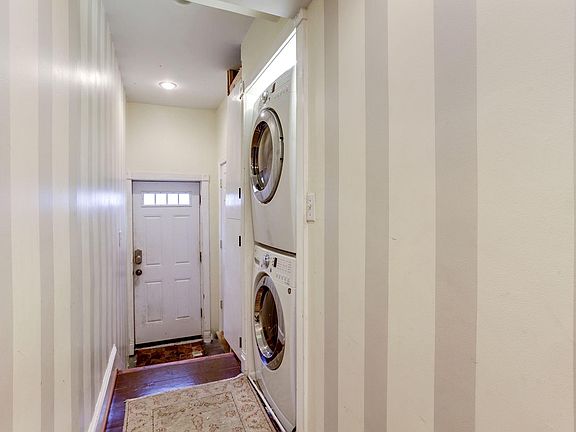 Interior foyer of apartment has a stackable washer/dryer!