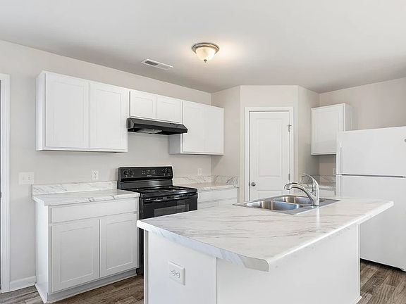 Kitchen
__ Gorgeous kitchen featuring modern countertops, white shaker cabinets & full island _ all appliances included!