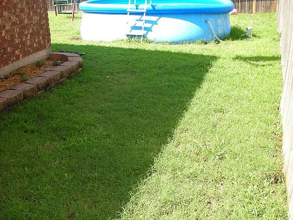 Backyard with above ground pool