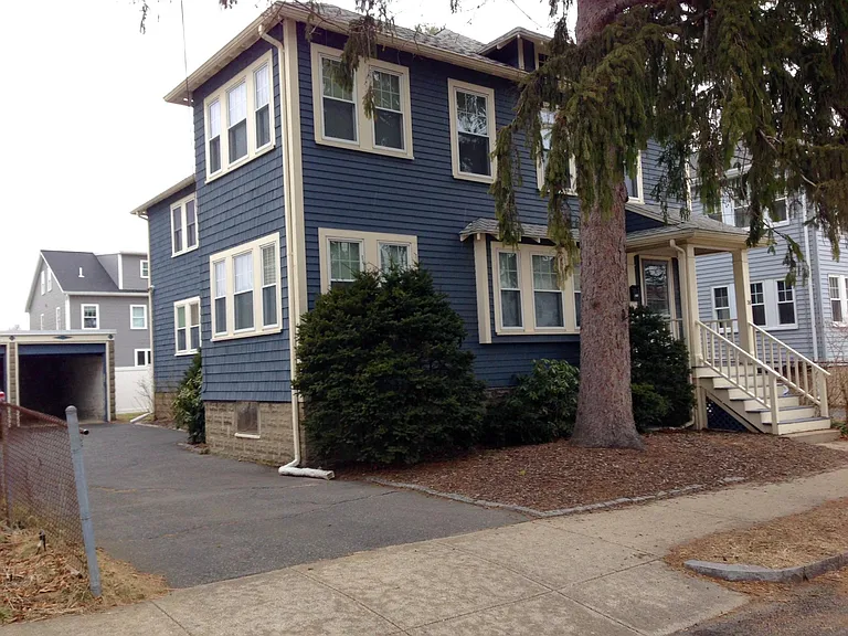 The driveway has been resurfaced and there is a baby pink dogwood where the spruce was.