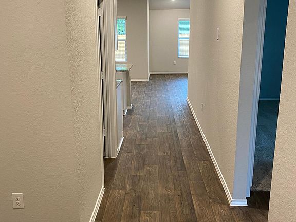 Hallway entrance of the house; garage door to the left and guest wing to the right