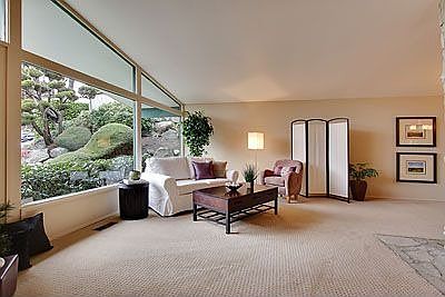 Light filled living room with soaring ceilings.