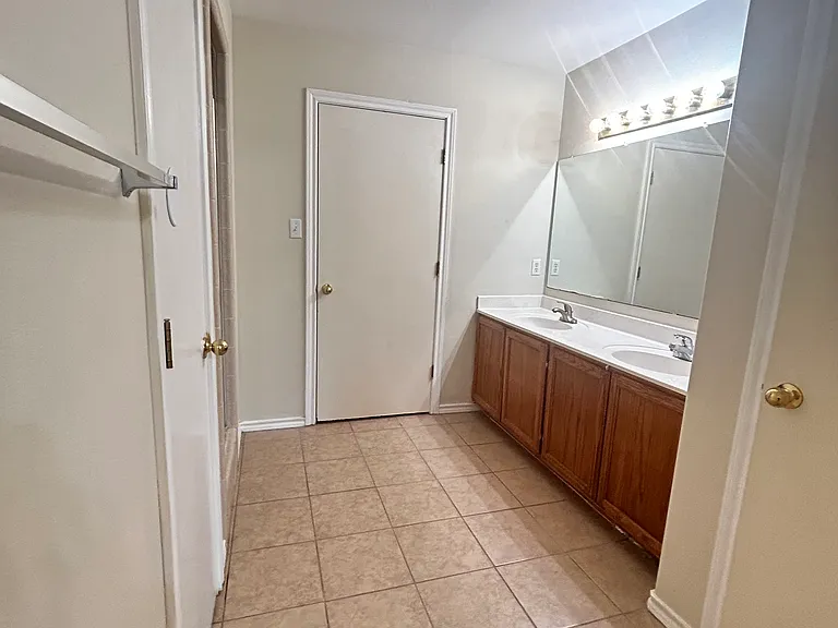 Master bathroom: double sinks, towel closet, private toilet, shower.