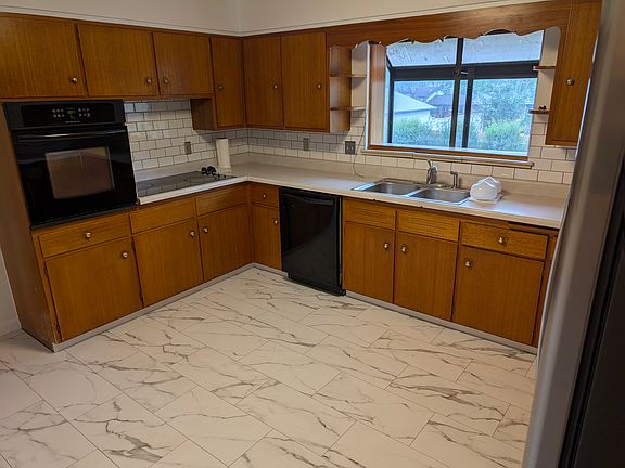 Kitchen with green house window, new flooring