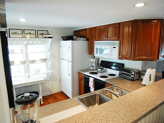 Refrigerator with ice maker, microwave, range, double sink w