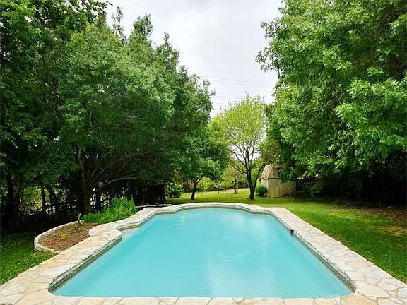 Incredible park-like backyard oasis! Yard goes way beyond the fruit trees. Gate to greenbelt at the 