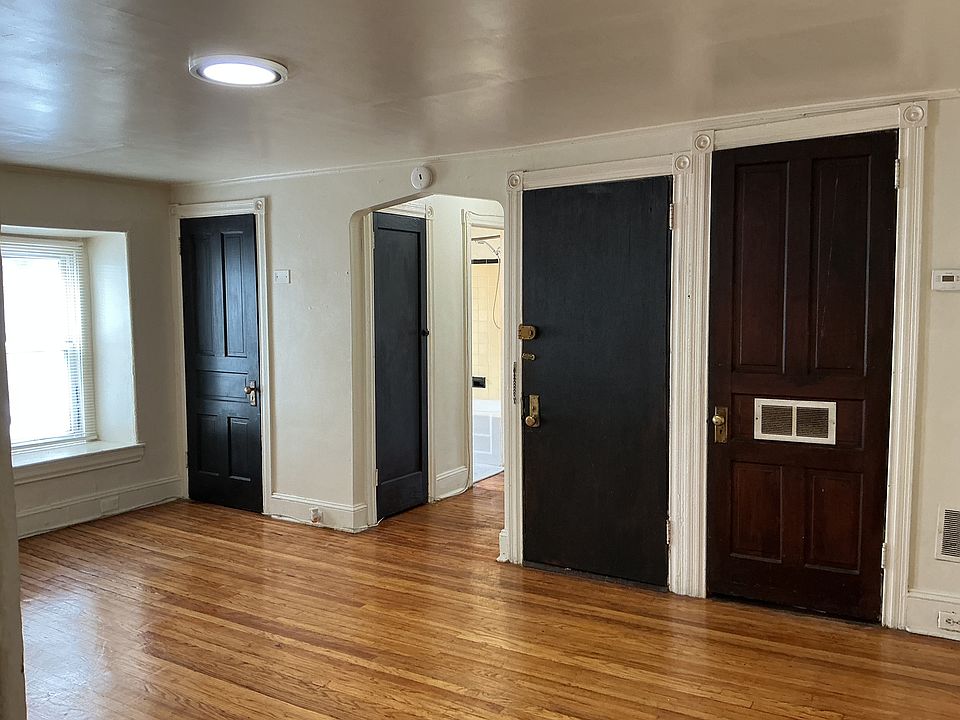 Living Room Coat Closet; Apartment Entry Door, and Heater/ Central Air Closet