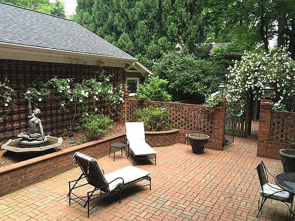 Patio leads to fenced yard