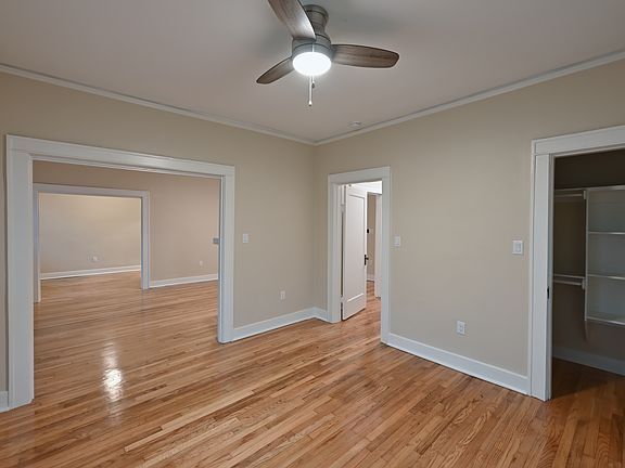 Bedroom view to living room with closet and bathroom hall