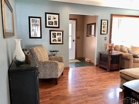 The living room is a large space with hardwood floors, and great natural lighting.