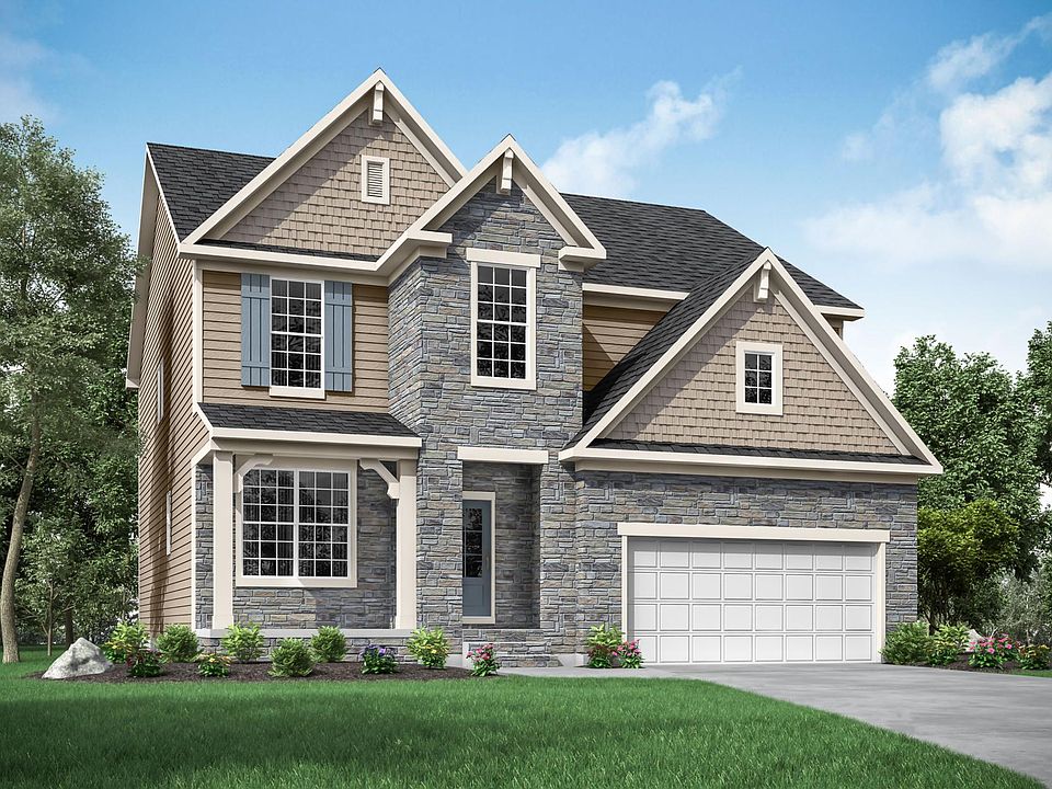 custom home with stone, siding and shakes