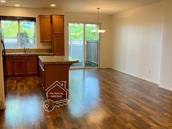 Open floor plan with kitchen + dining + family room