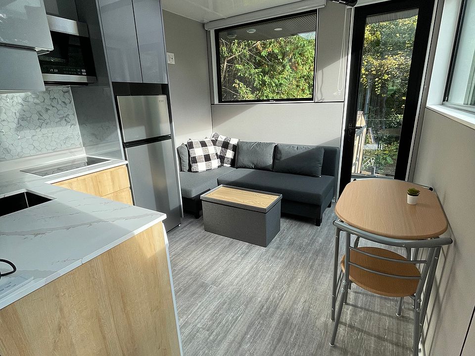 Kitchen area which includes pull down Smart TV