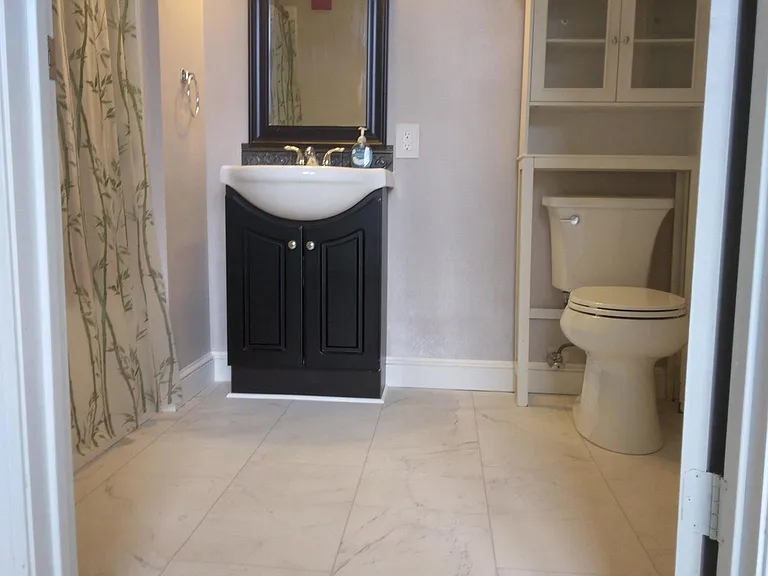 En Suite full bath adjoining Master Bedroom.