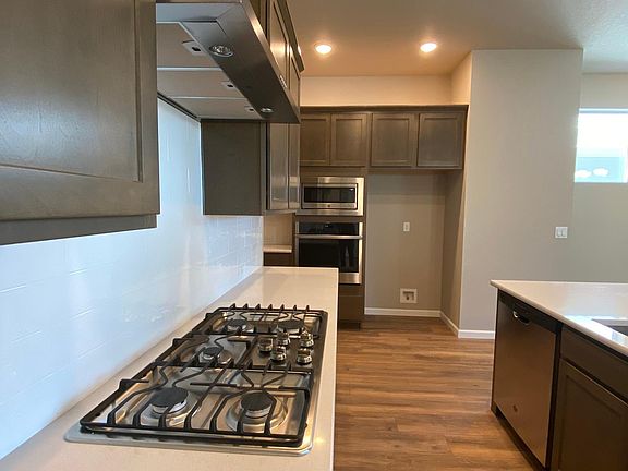 Gas range, oven, microwave, dishwasher. Refrigerator included but not pictured.