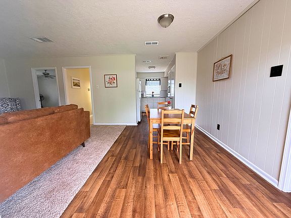 Outdoor View of Living Room, Dinning Room, Kitchen