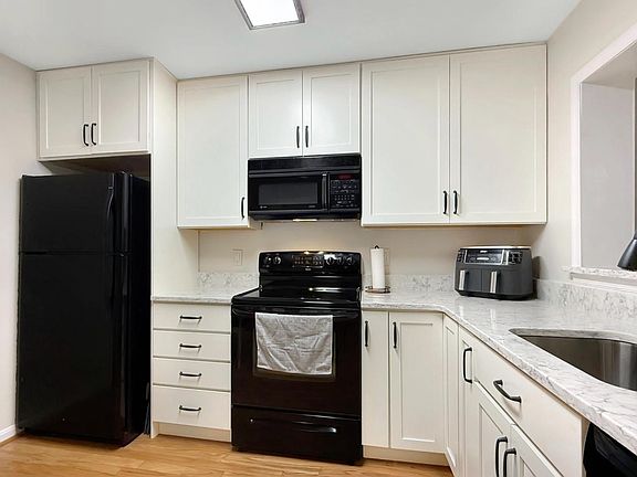 Newly renovated kitchen with breakfast nook, pantry, and pass through