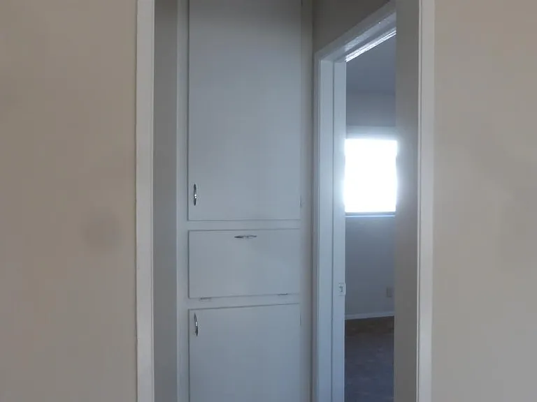 walking toward hallway to bedroom