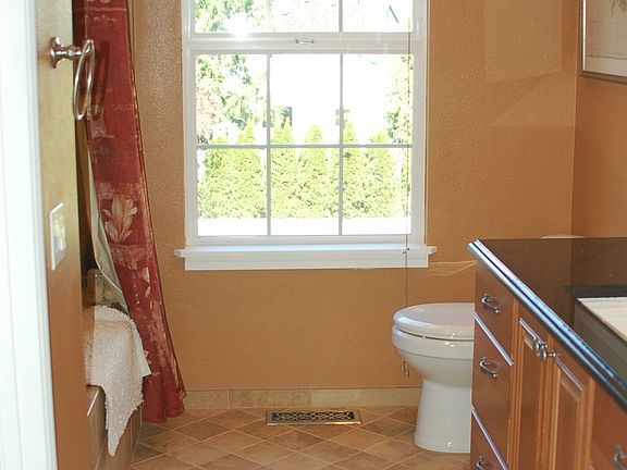 master bath with granite counter top, jacuzzi tub, italian tile