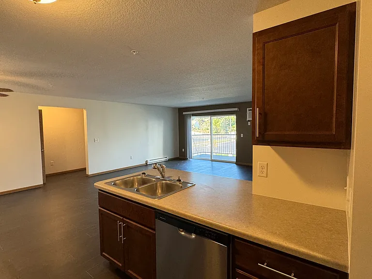 Kitchen, includes: Electric Stove/Oven, Refrigerator/Freezer, Dishwasher and Microwave.