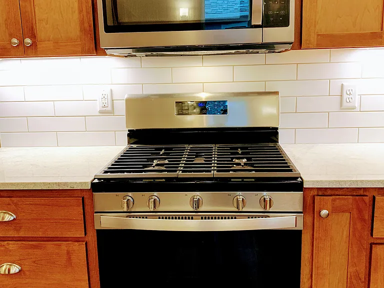 Granite counters, gas stove and spacious cabinets.