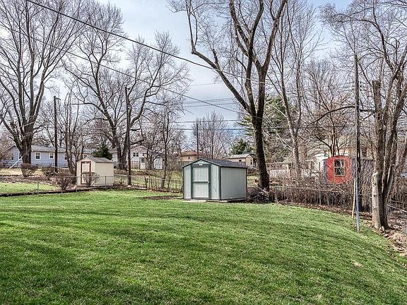 Shed in backyard for storage.