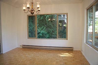 Dining area with large windows and door to deck