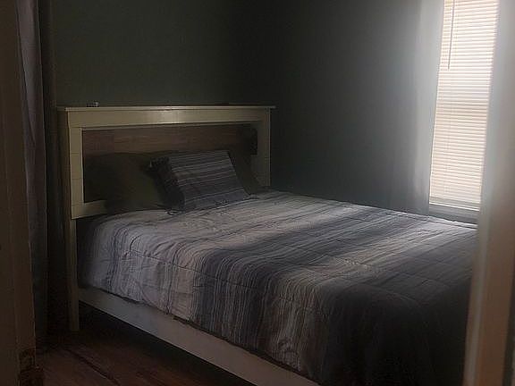 Bedroom with walk-in closet