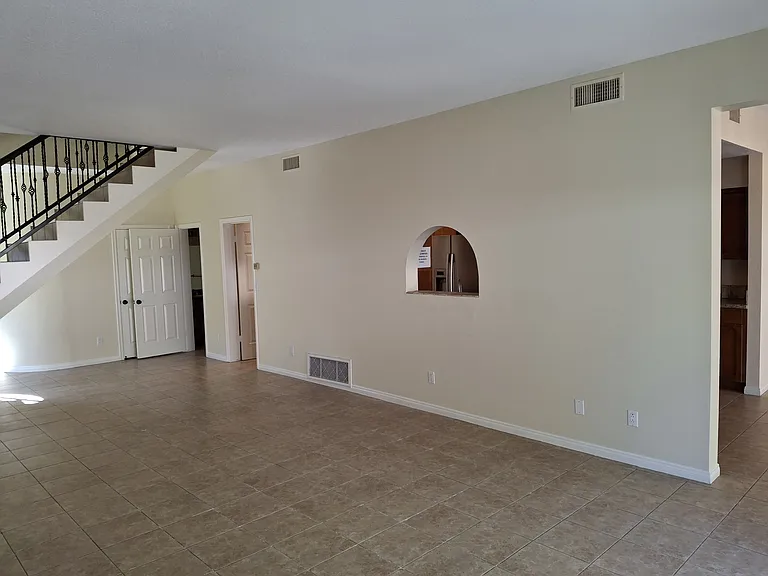 Living room with window from kitchen