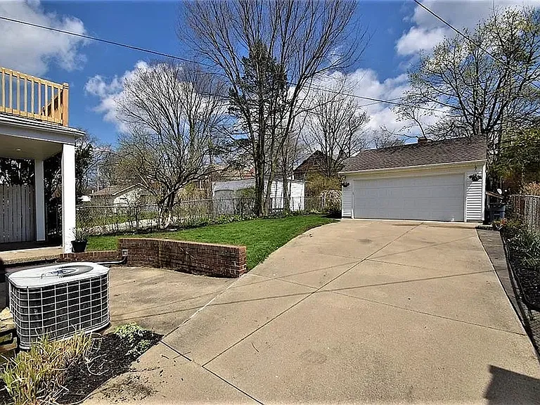 Fenced in back yard with 2 car garage