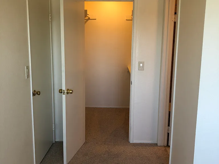 Walk in closet for primary bedroom.