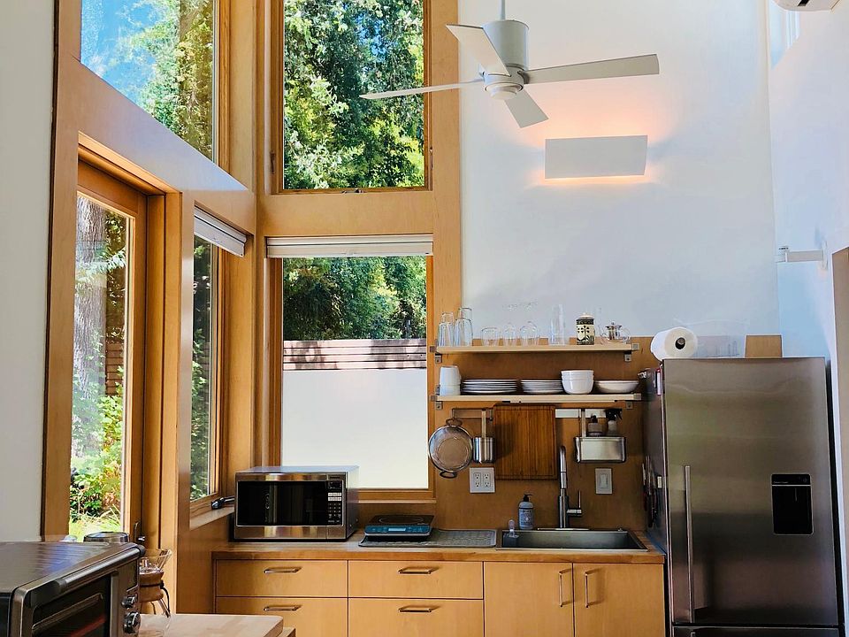 Enter into the Great Room, with the fully stocked kitchen.