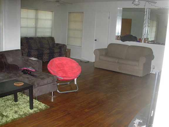Shorter portion of the "L" shaped very large living room.