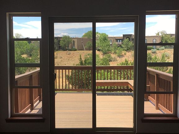 Indoor view of deck & open space behind the townhouse