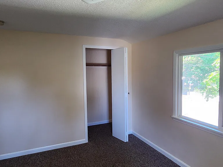 Master Bedroom facing closet and main window
