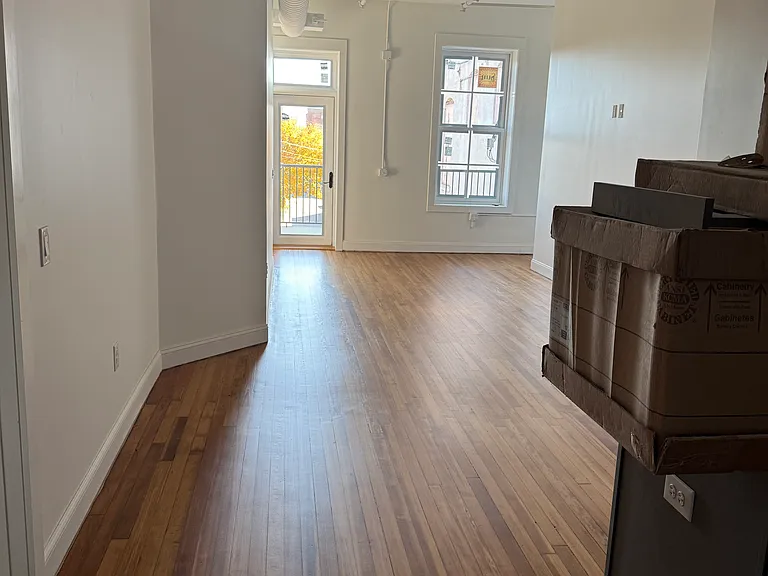 Large living room with balcony door