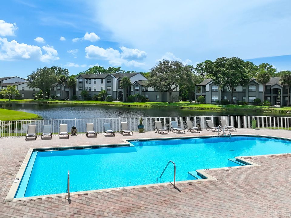 Sun-soaked serenity meets lakeside elegance at our expansive pool and sundeck!